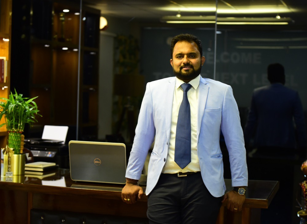 OGS Facility Management Founder OGS Facility Management founder in Whitefield standing confidently in a modern office environment.